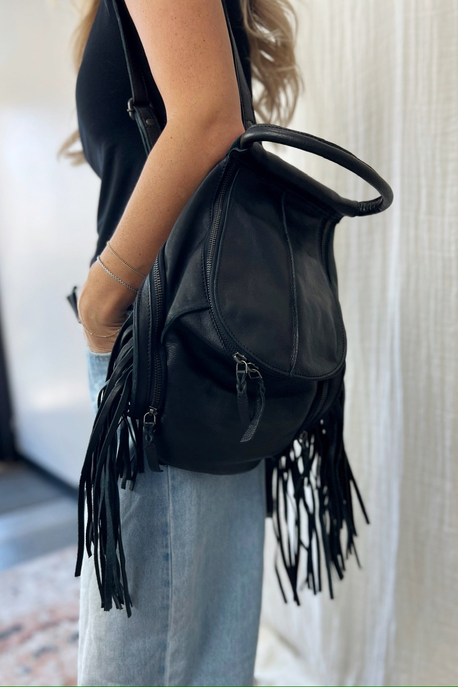 black fringe backpack